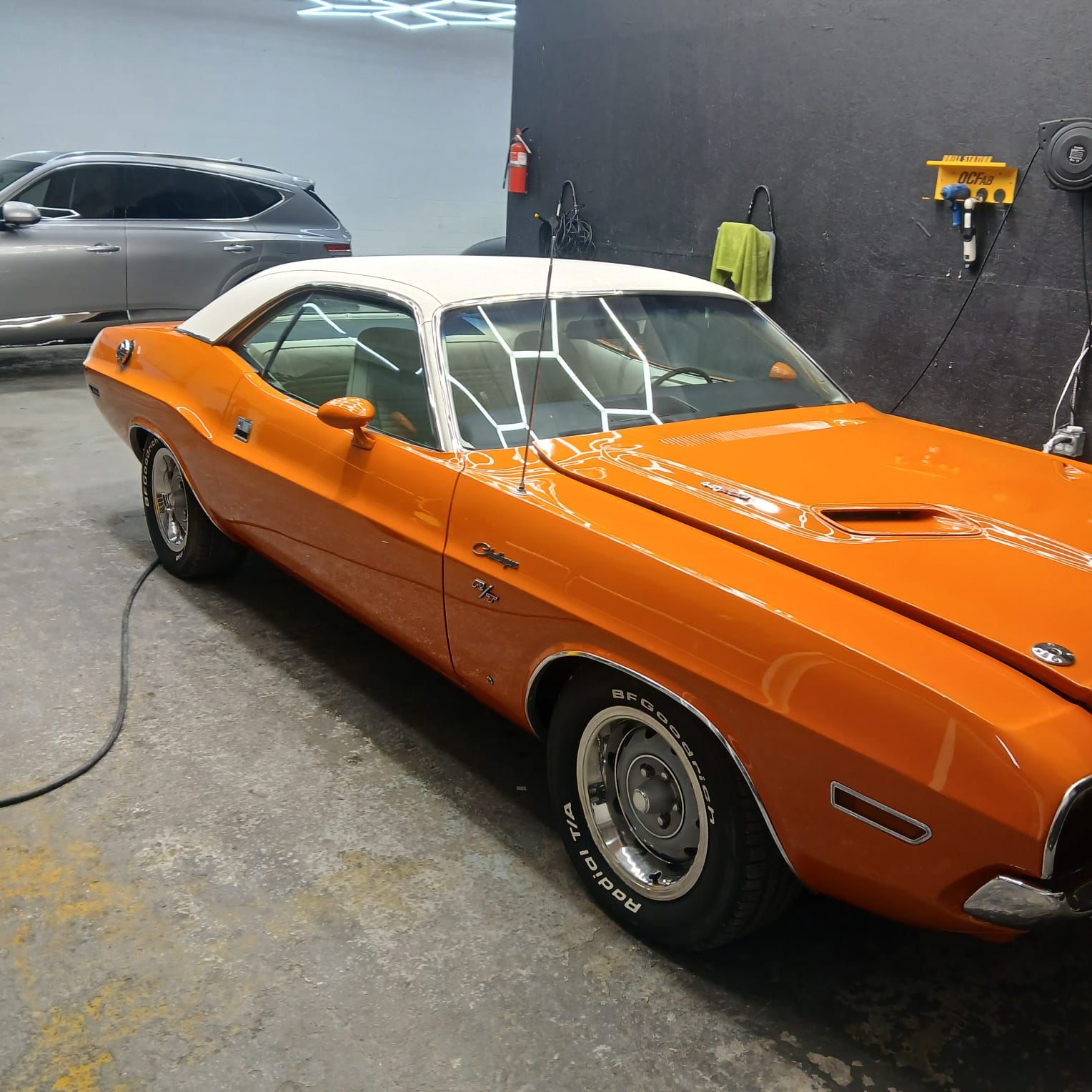 Restored orange Dodge Challenger R/T after a full detail